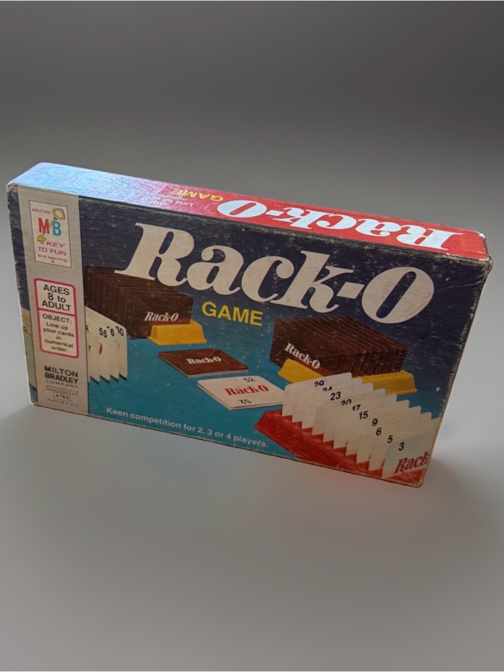 Vintage 1975 edition of the classic Rack-O card/number game. Complete. Good cond